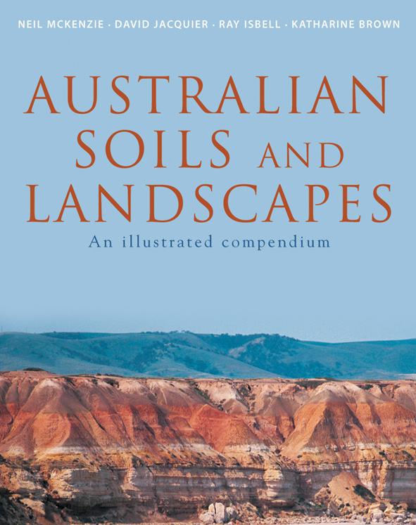 The cover image of Australian Soils and Landscapes, featuring a panoramic view of a cliff side with strips of different red, yellow and grey earth, wi