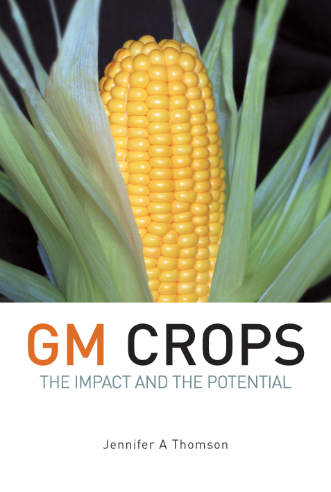 The cover image of GM Crops, featuring a large cob of yellow corn, surrounded by its leaves, against a plain black background.