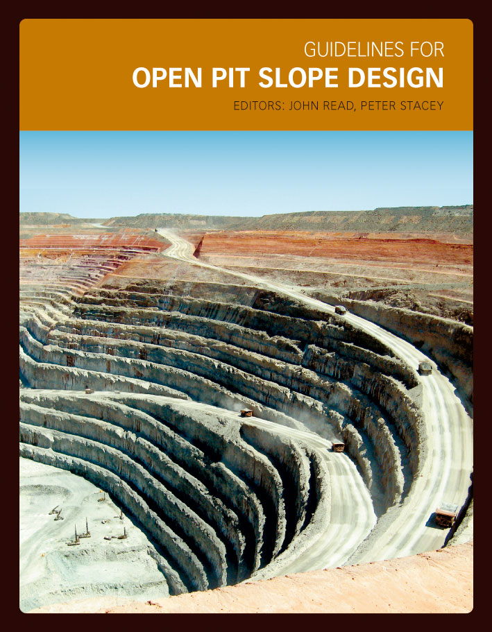 The cover image featuring a partial view of an open grey mining pit, with a pale blue sky background.