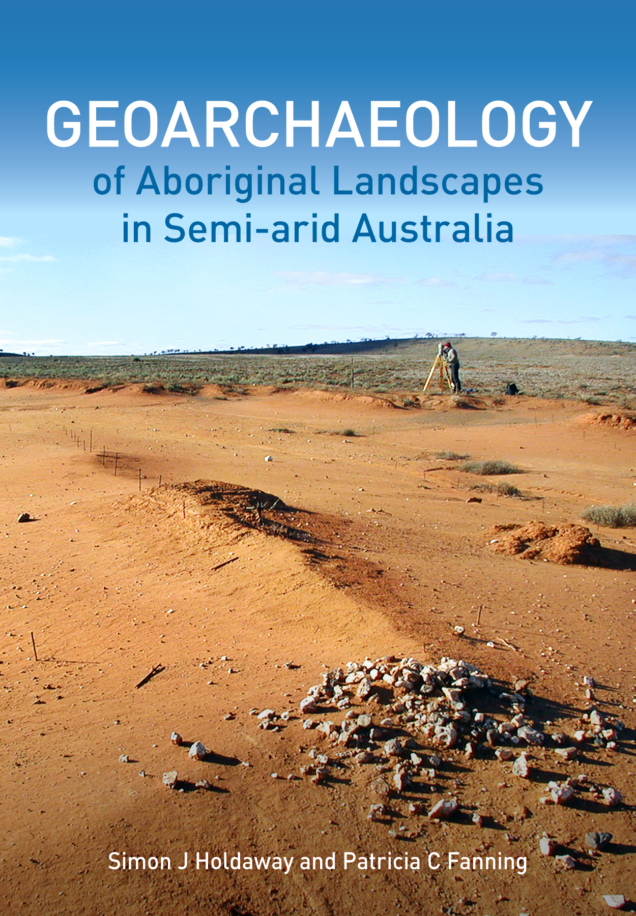 The cover image featuring a brown desert expanse with sparse pebbles with clear blue sky in background.