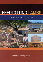 The cover image of Feedlotting Lambs, featuring lambs standing on red eart