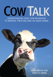 Cover image of Cow Talk, featuring a close-up photo of a dairy cow on a bl