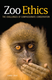 Cover featuring a portrait of a mandrill, with its hand over its mouth and