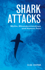 Cover image of Shark Attacks featuring a photo of the silhouette of a shark in blue water