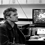 A black-and-white photograph of Dr Angus McEwan and his ‘rotating table’ at the CSIRO Aspendale laboratory.