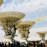 Photograph of a small crowd at the opening of the Australia Telescope in 1988.