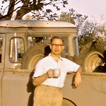 Photograph of Robert Kirk leaning on a pickup truck at Pineapple Bore, Halls Creek, Northern Territory.